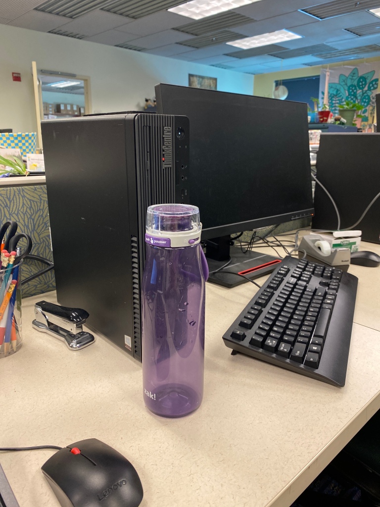 A picture of the computers I’m sitting at, and a close-up of my water bottle. ￼